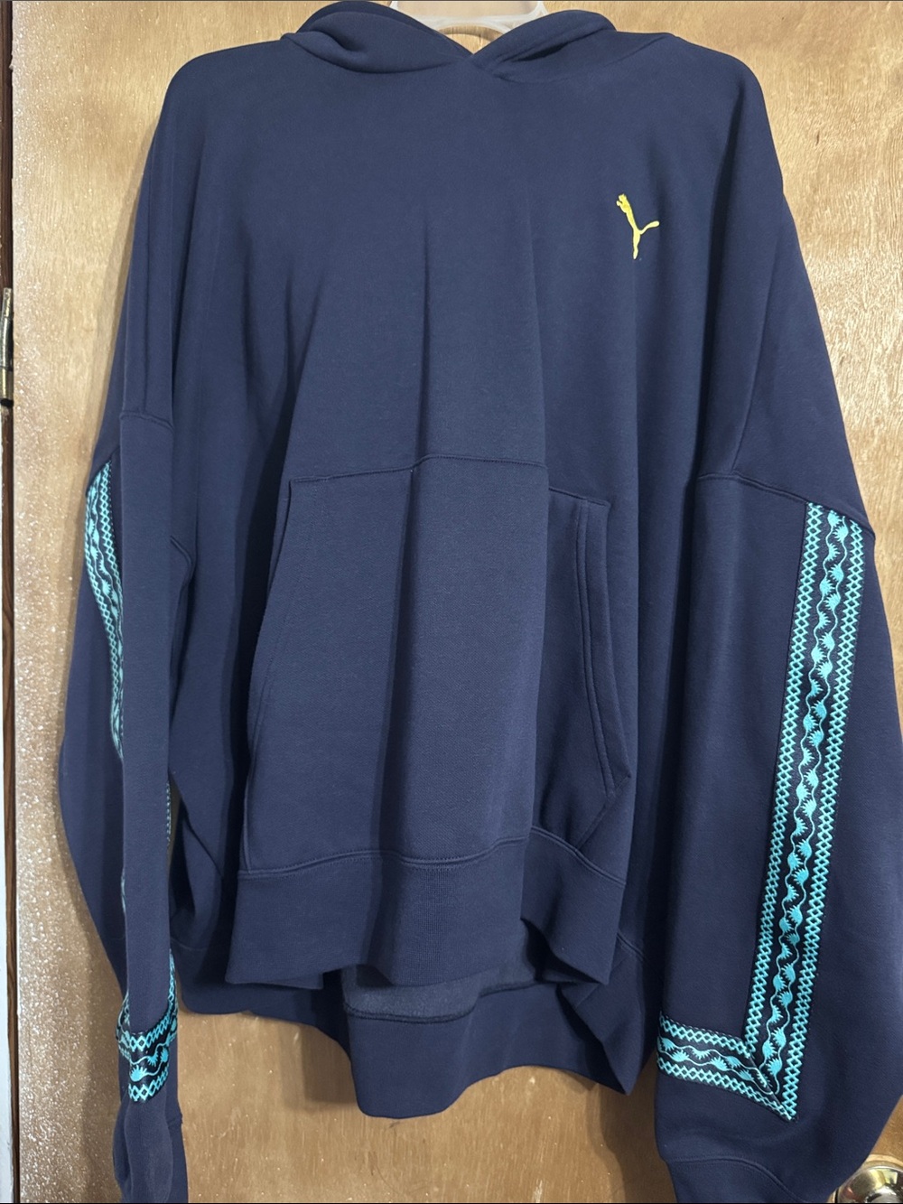 Puma Navy Zip-Up Hoodie with Teal Sleeve Trim and Yellow Logo